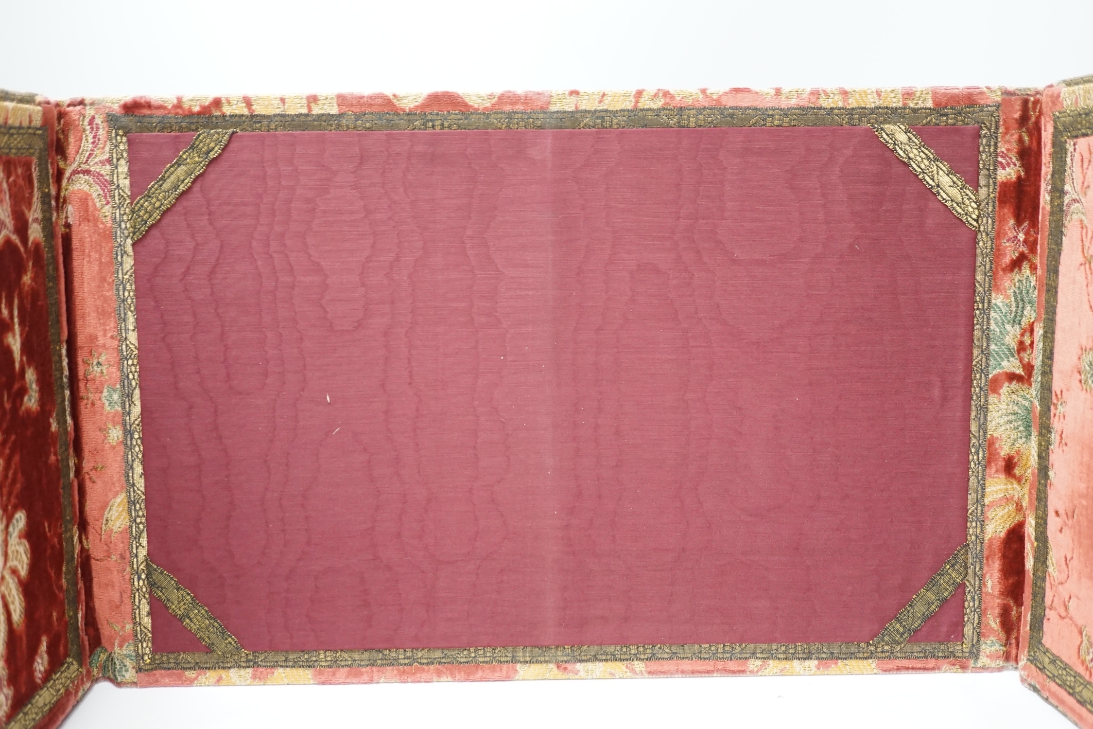 An 18th century style embroidered writing pad in damask and velvet, 32 x 51cm. Condition - poor to fair, generally faded